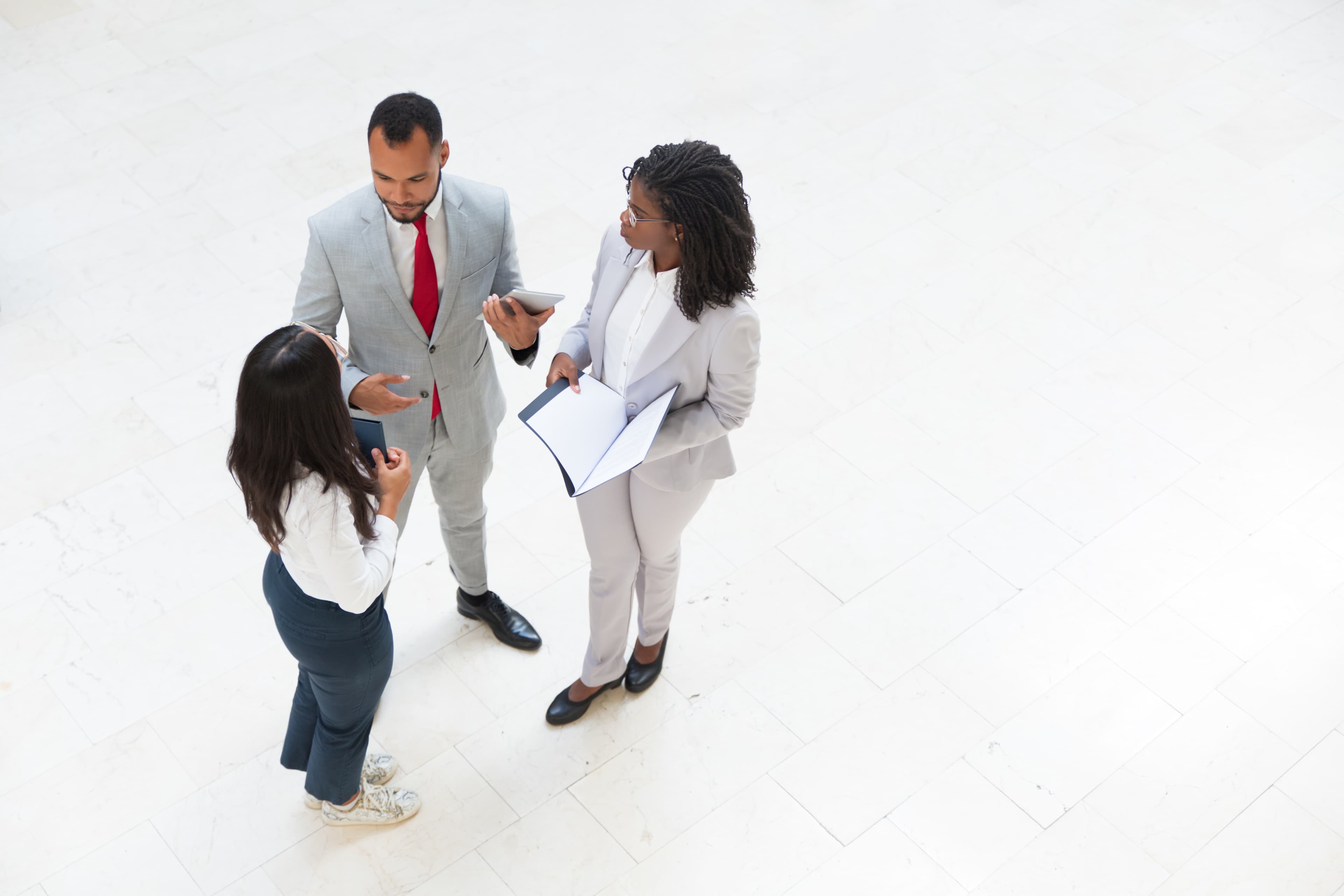 Diverse business team in office hallway